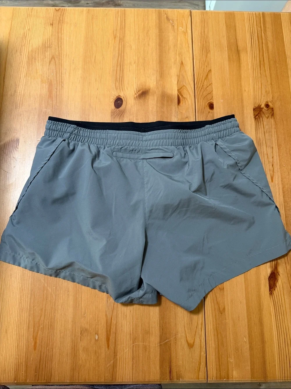 Nike Gray Athletic Shorts with Black Waistband and White Swoosh